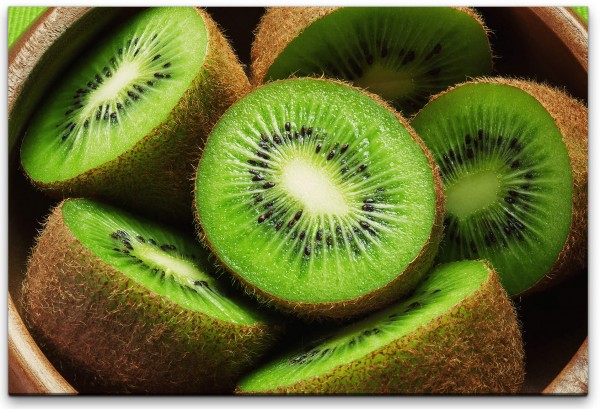 Kiwis in einer Holz Schüssel Wandbild in verschiedenen Größen